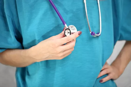 Doctor with stethoscope, close up.